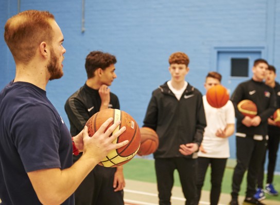 Sport students working with sport staff