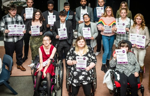 Further Education Award winners standing with their certificates