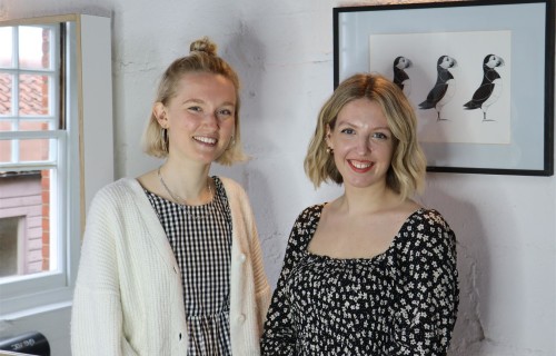 Two female students pose for a photo