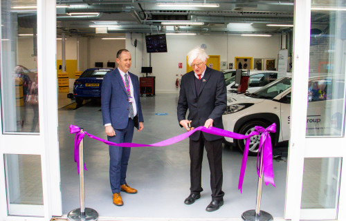 Ribbon cutting at a car show