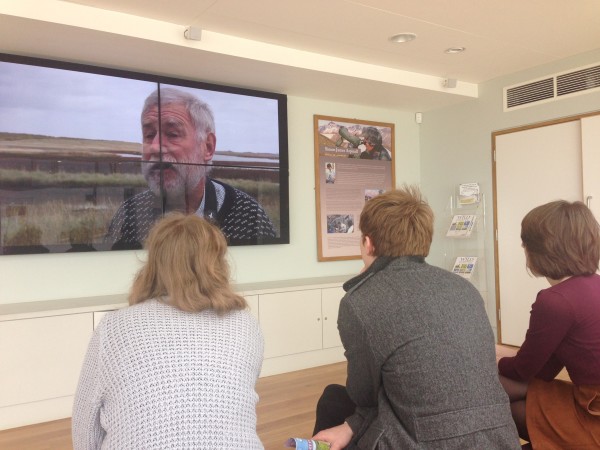 Media Learning Company students watching their documentary for Norfolk Wildlife Trust play at the Simon Aspinall Visitor Centre, Cley, in 2016.