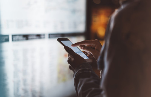 Person touching their phone's screen